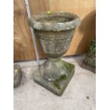 A LARGE STONE URN - APPROXIMATELY 63 CM HIGH