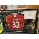 A LARGE FRAMED MANCHESTER UNITED SHIRT SIGNED BY TEVEZ WITH COA NUMBER 100218, ALSO WITH TWO