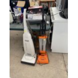 A WHITE PANASONIC VACUUM CLEANER AND A FURTHER POWER FOAMER