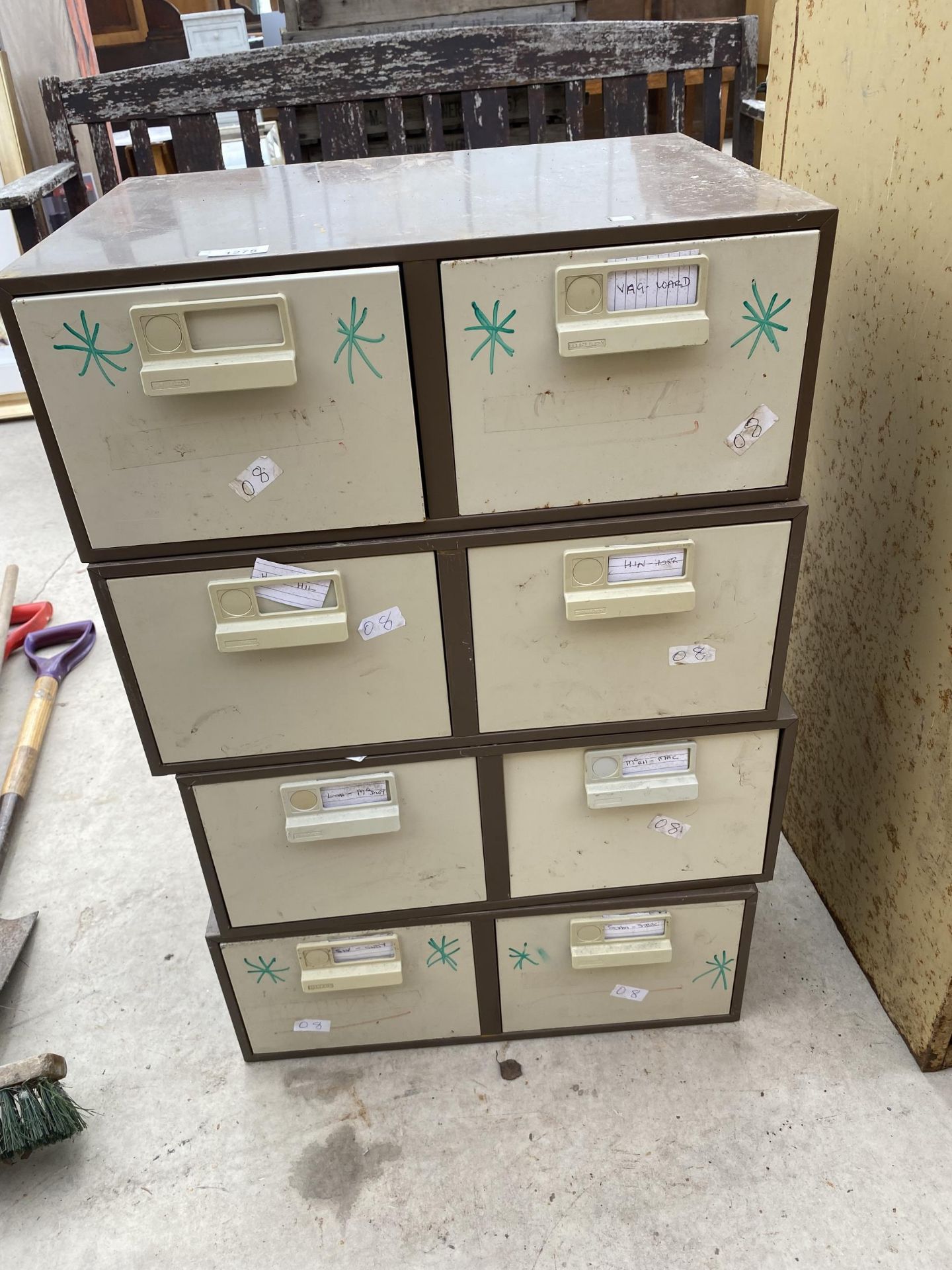 A GROUP OF FOUR TWO DRAWER STACKING STORAGE UNITS