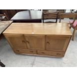 AN ERCOL WINDSOR SIDEBOARD ENCLOSING TWO DRAWERS AND THREE CUPBOARDS, 51" WIDE