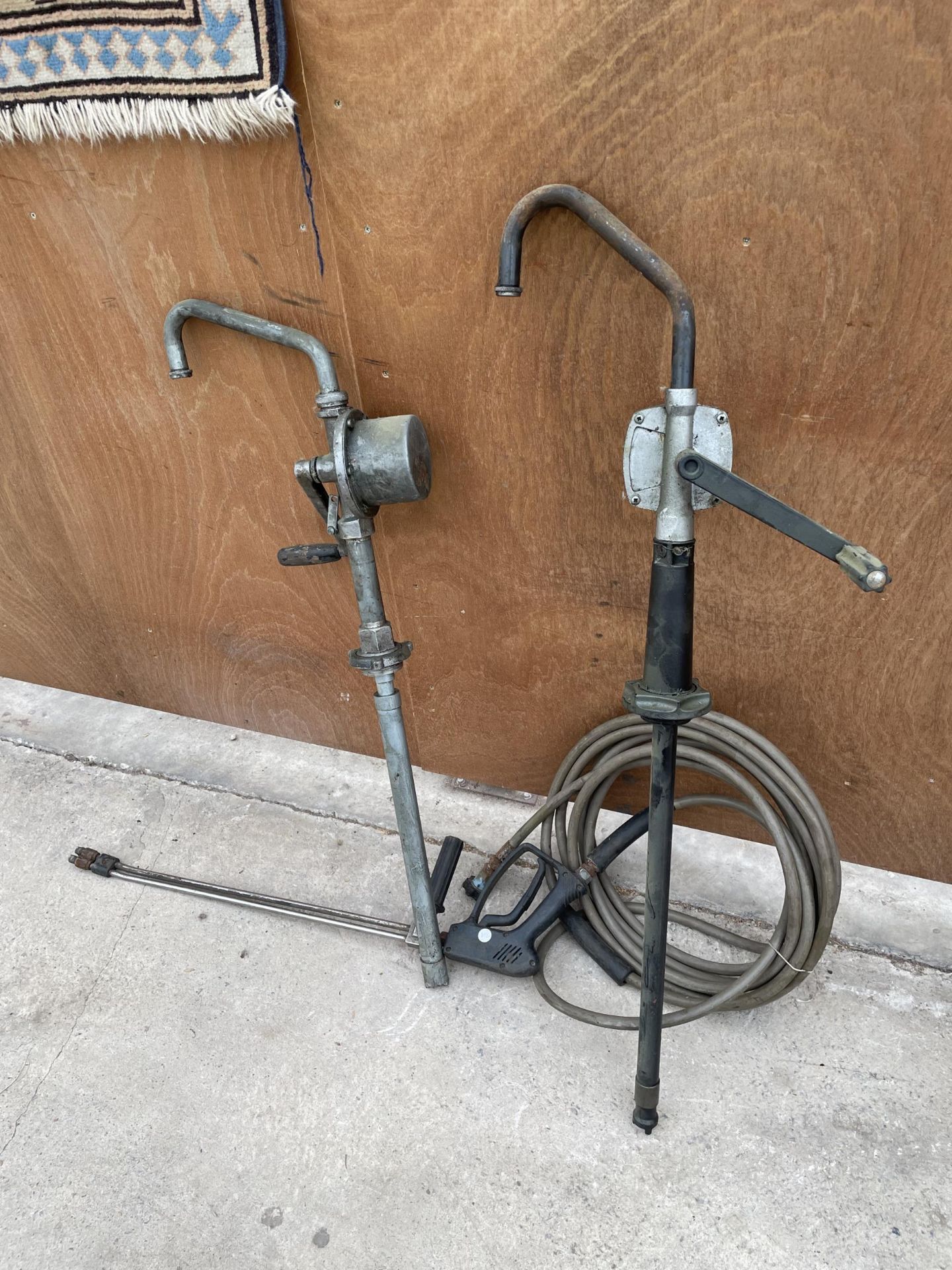 TWO BARREL PUMPS AND A PRESSURE WASHER HOSE AND LANCE