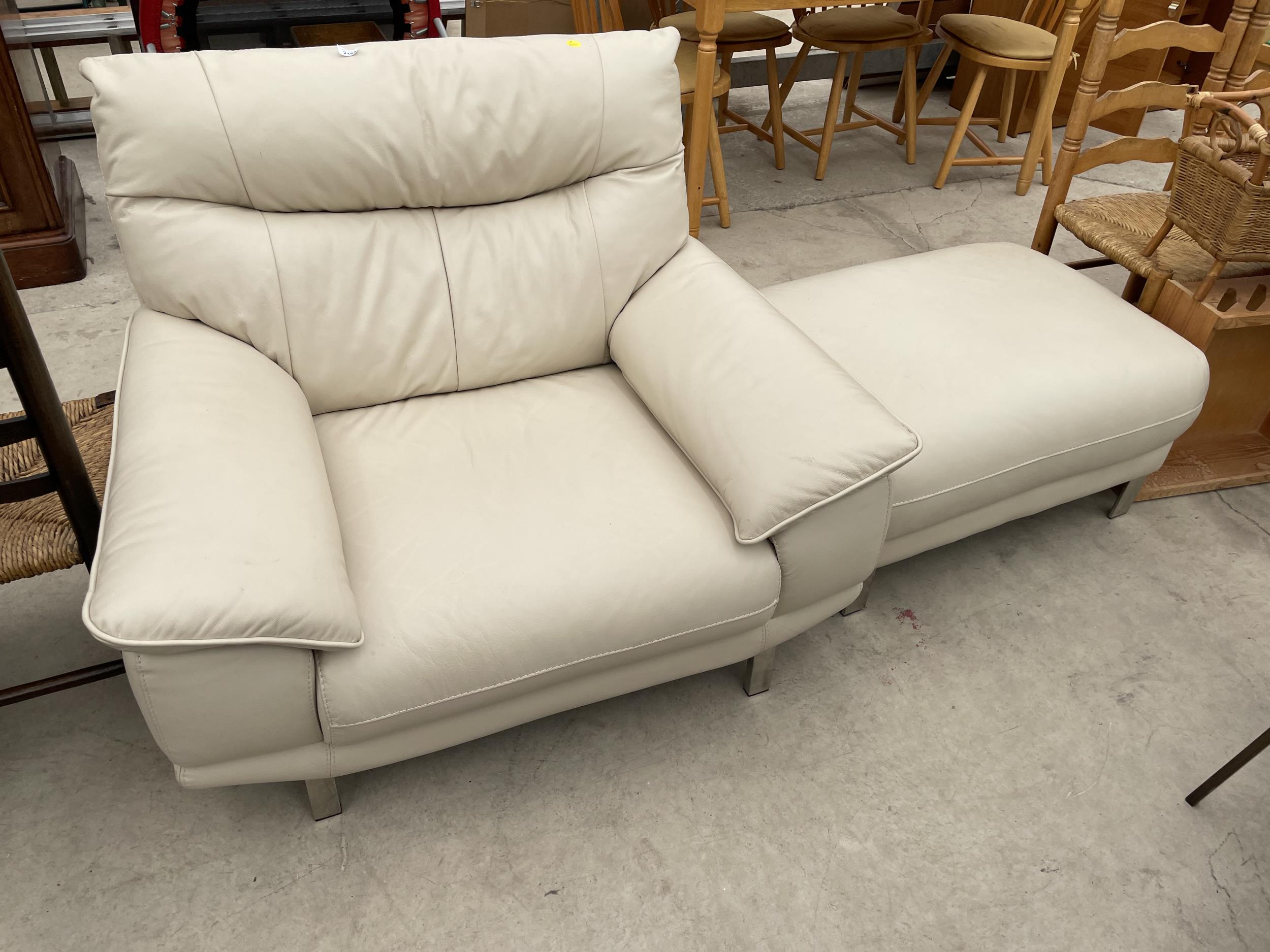 A MODERN WHITE LEATHER EASY CHAIR ON CHROME LEGS AND MATCHING STOOL