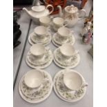 A SET OF SIX QUEEN ANNE BONE CHINA TRIOS. LOT ALSO INCLUDES TWO TEA POTS AND TWO ROYAL ALBERT