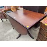 A MAHOGANY DROP-LEAF DINING TABLE