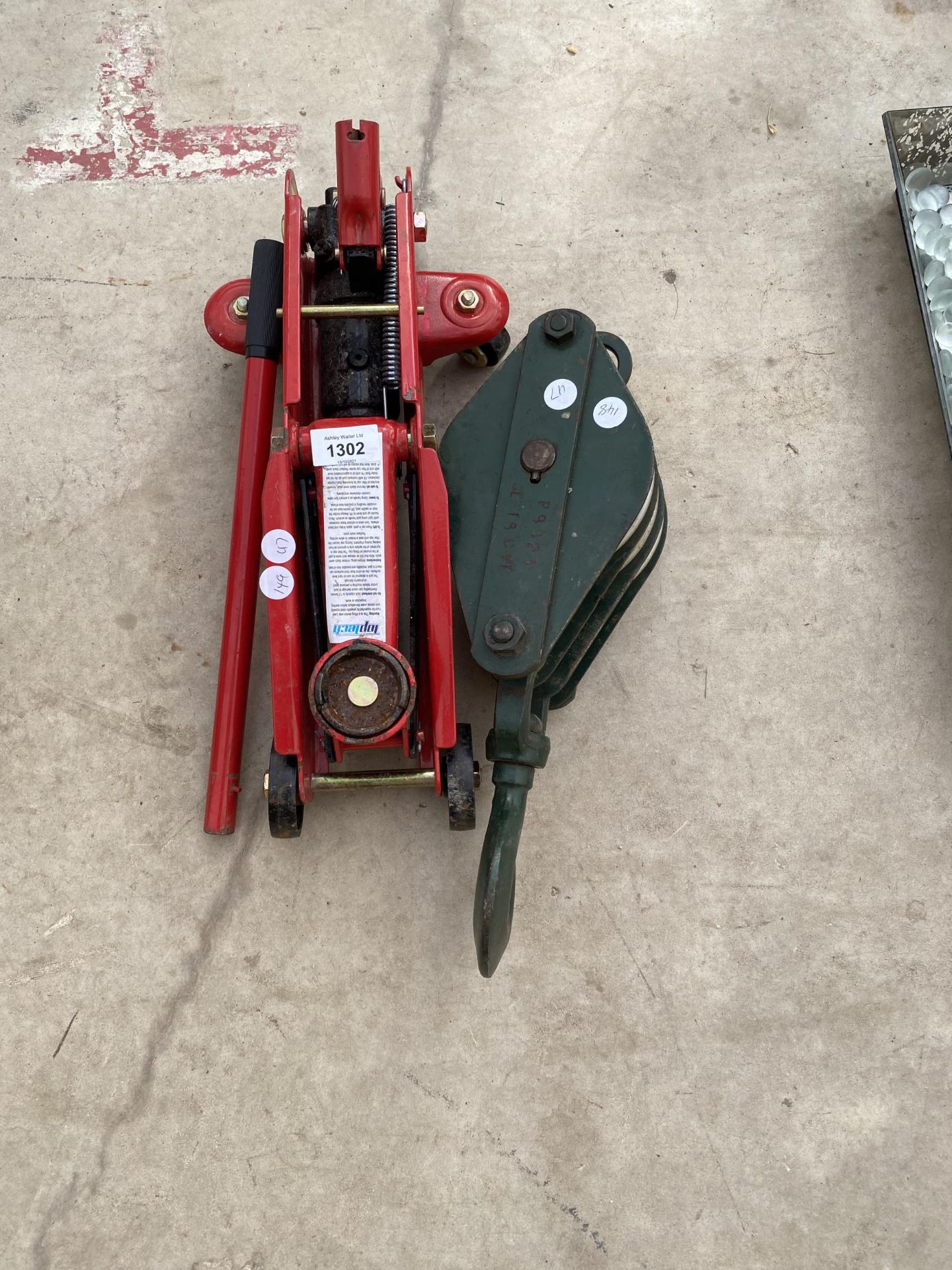 A WINCH PULLEY BRACKET WITH HOOK AND A TROLLEY JACK