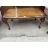 A MAHOGANY COFFEE TABLE ON CABRIOLE SUPPORTS WITH GLASS TOP