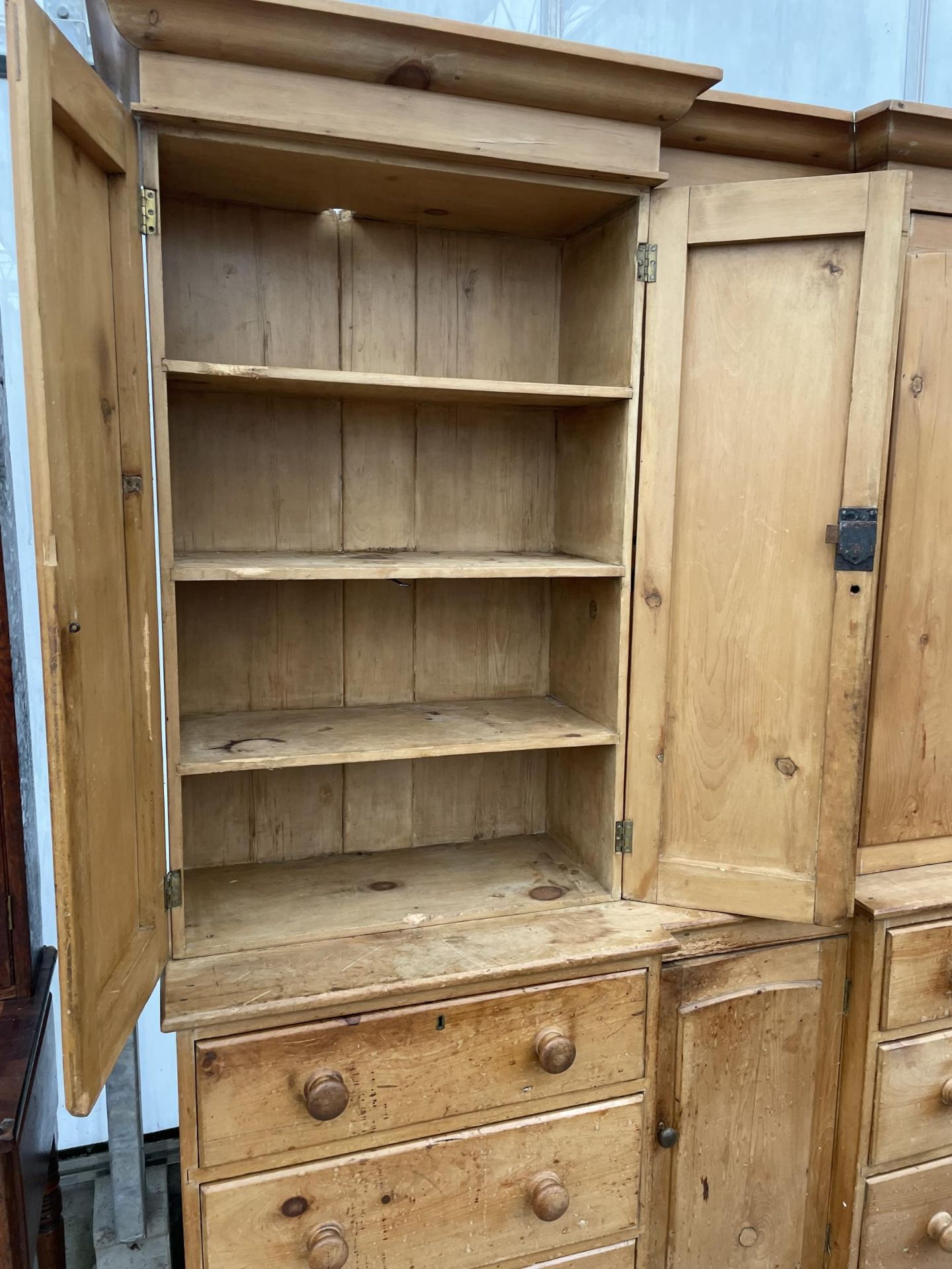 A VICTORIAN PINE INVERTED BREAKFRONT HOUSEKEEPERS CUPBOARD WITH SIX DRAWERS AND CUPBOARD TO THE - Image 8 of 9