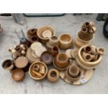 A LARGE ASSORTMENT OF TURNED TREEN ITEMS TO INCLUDE BOWLS, VASES AND NAPKIN RINGS ETC