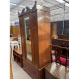 AN EDWARDIAN MAHOGANY MIRROR-DOOR WARDROBE