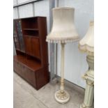 A CREAM AND GILT STANDARD LAMP ON TURNED AND FLUTED COLUMN, COMPLETE WITH SHADE