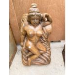 A TREEN CARVED FIGURE OF A NUDE FEMALE