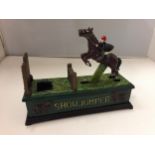 A CAST IRON SHOWJUMPER MONEY BOX