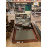 A SHELVED WOODEN FISHING BOX FILLED WITH ITEMS RELATED TO MAKING FISHING FLIES. INCLUDES,