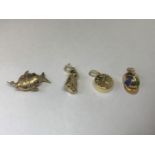 FOUOR 9 CARAT GOLD CHARMS TO INCLUDE A JOCKEY SILK, POCKET WATCH, DOG AND FISH GROSS WEIGHT 5.7