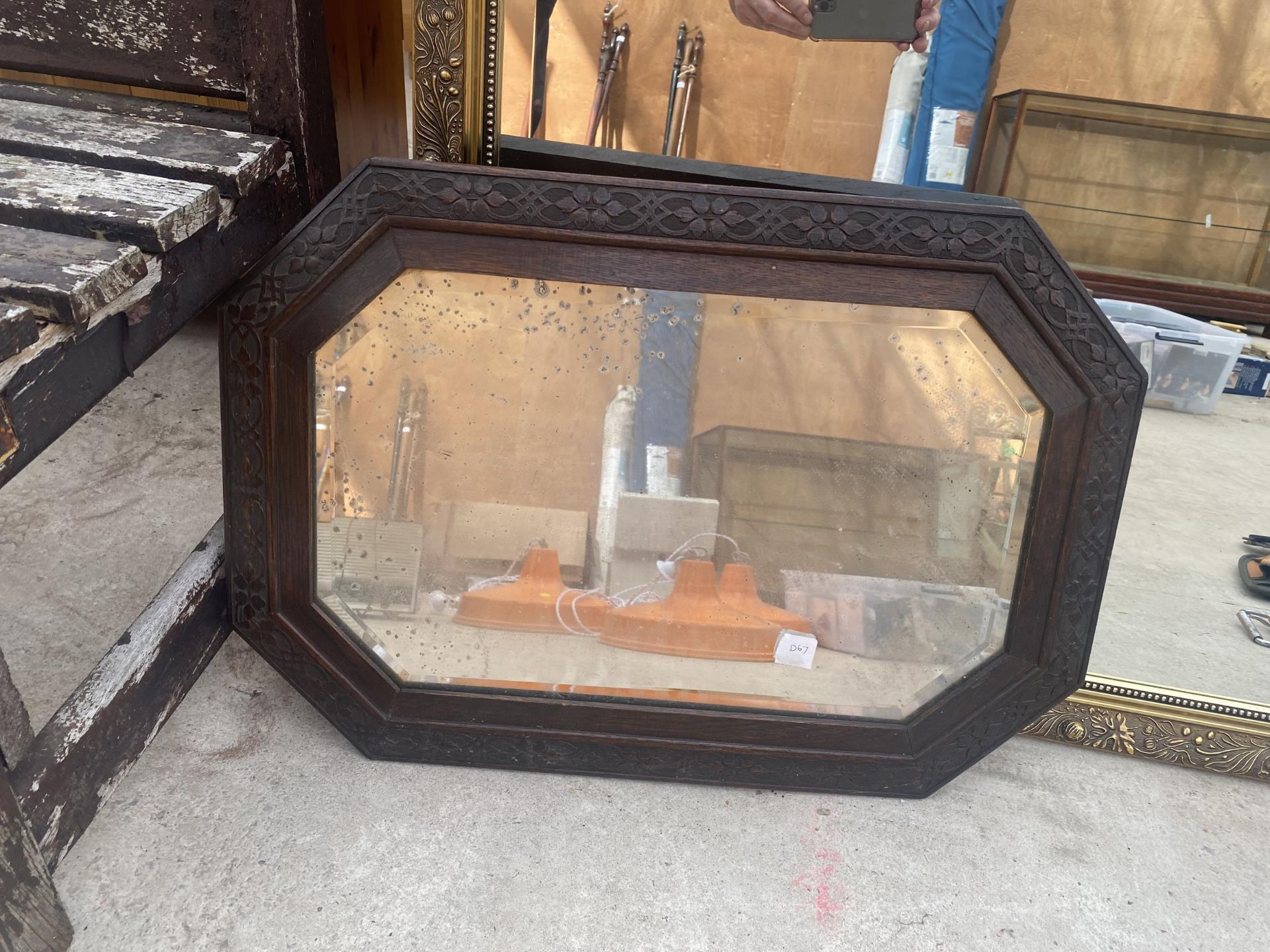 A LARGE DECORATIVE GILT FRAMED BEVELED EDGE MIRROR AND A FURTHER CARVED OAK FRAMED MIRROR - Image 2 of 4