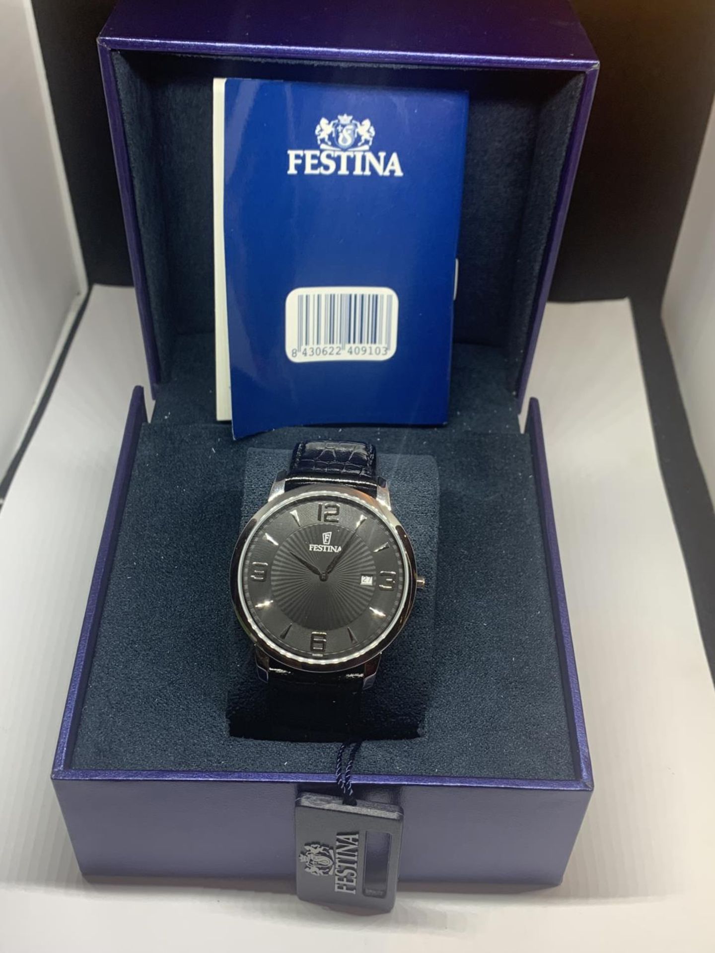 A BOXED FESTINA CALENDAR WRIST WATCH