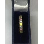 A 9 CARAT GOLD RING WITH SEVEN IN LINE MULTI COLOURED STONES SIZE Q WITH A PRESENTATION BOX