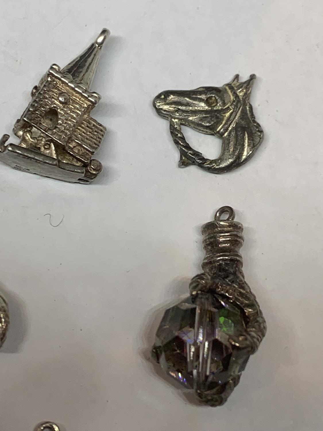 ELEVEN VARIOUS SILVER CHARMS TO INCLUDE HORSES, MOULIN ROUGE DANCER, DOG, TRAIN CHURCH ETC - Image 3 of 5