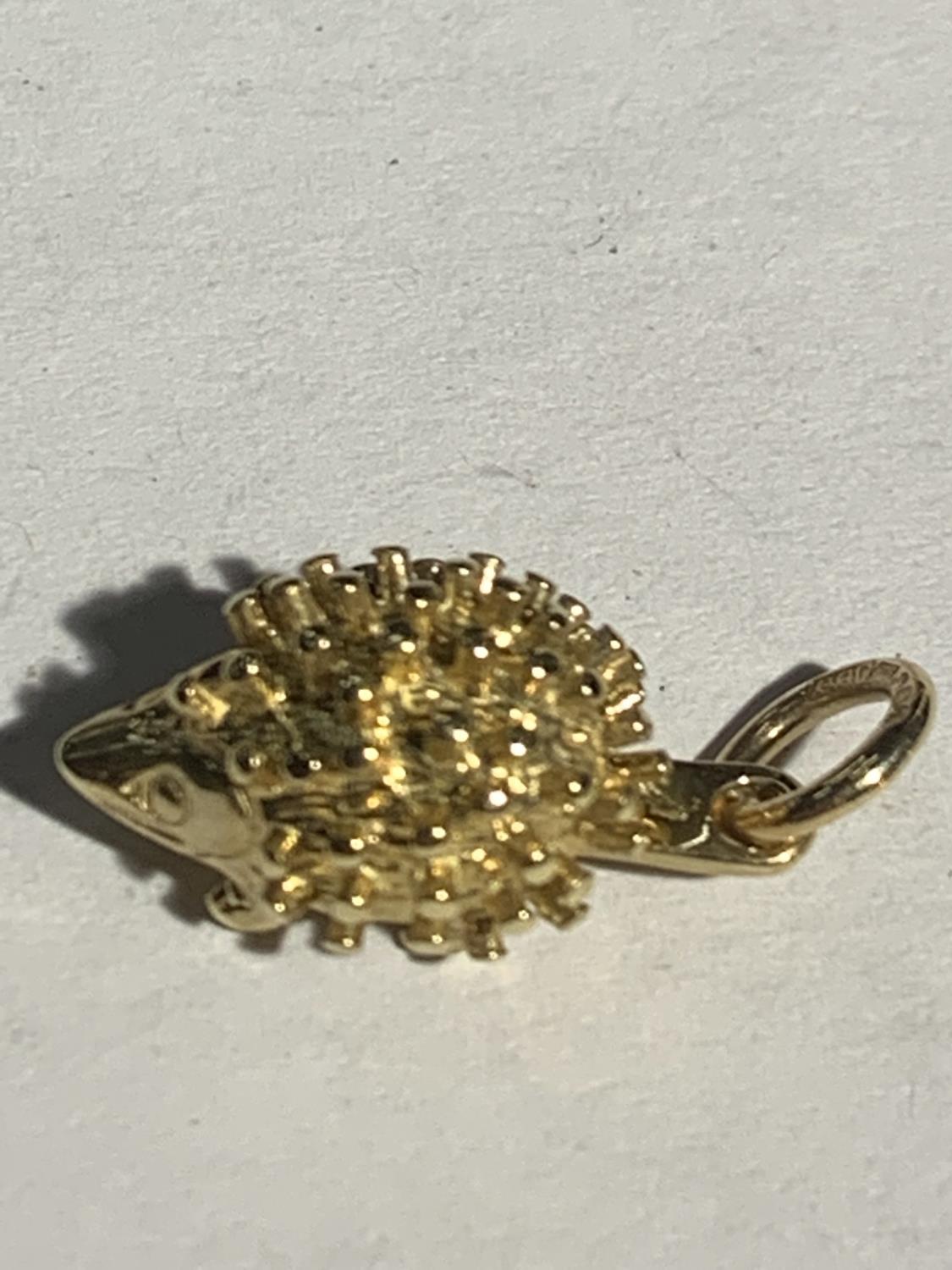 TWO 9 CARAT GOLD CHARMS - A HEDGEHOG AND DOLPHINS GROSS WEIGHT 3.2 GRAMS - Image 2 of 3