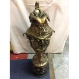 AN EXTREMELY LARGE AND HIGHLY DECORATIVE TRI COLOURED BRONZE URN DEPICTING GODDESS, CHERUBS, FISH