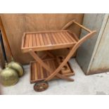A TEAK TWO TIERED TROLLEY WITH REMOVABLE TRAY AND LOWER BOTTLE HOLDER