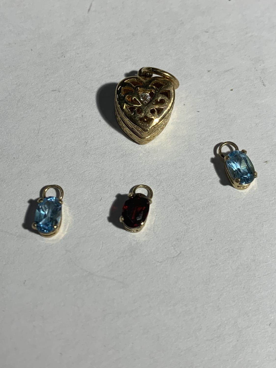 FOUR VARIOUS 9 CARAT GOLD PENDANTS GROSS WEIGHT 3.5 GRAMS