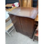 A MAHOGANY AND INLAID TV CABINET