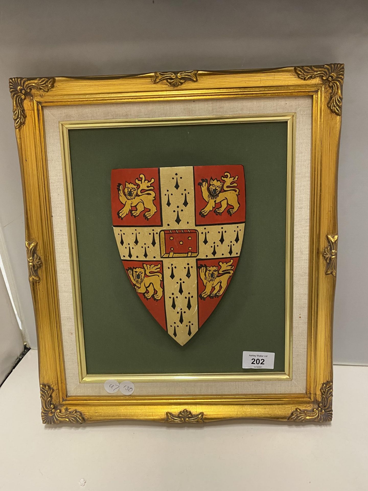 A FRAMED HERALDIC COAT OF ARMS