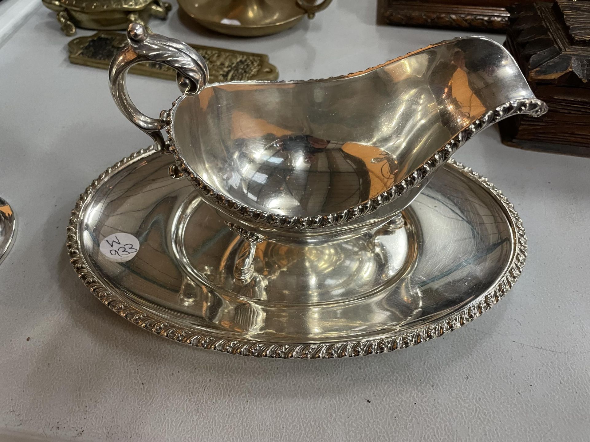 THREE PIECES OF SILVER PLATE TO INCLUDE A SAUCE BOAT, A SALVER AND A TWO HANDLED DISH WITH A GREEN