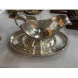 THREE PIECES OF SILVER PLATE TO INCLUDE A SAUCE BOAT, A SALVER AND A TWO HANDLED DISH WITH A GREEN