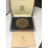 A ROYAL MINT MEDALLION IN A PRESENTATION BOX