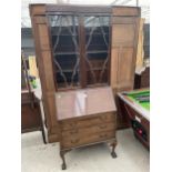 AN EDWARDIAN MAHOGANY BUREAU BOOKCASE ON CABRIOLE LEGS, WITH BALL AND CLAW FEET, 30" WIDE