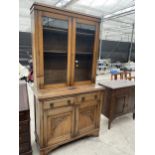 AN EARLY 20TH CENTURY OAK TWO DOOR GLAZED BOOKCASE ON BASE, 42" WIDE