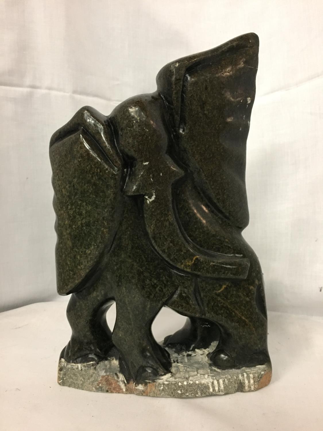 A SOAP STONE CARVING OF AN ELEPHANT