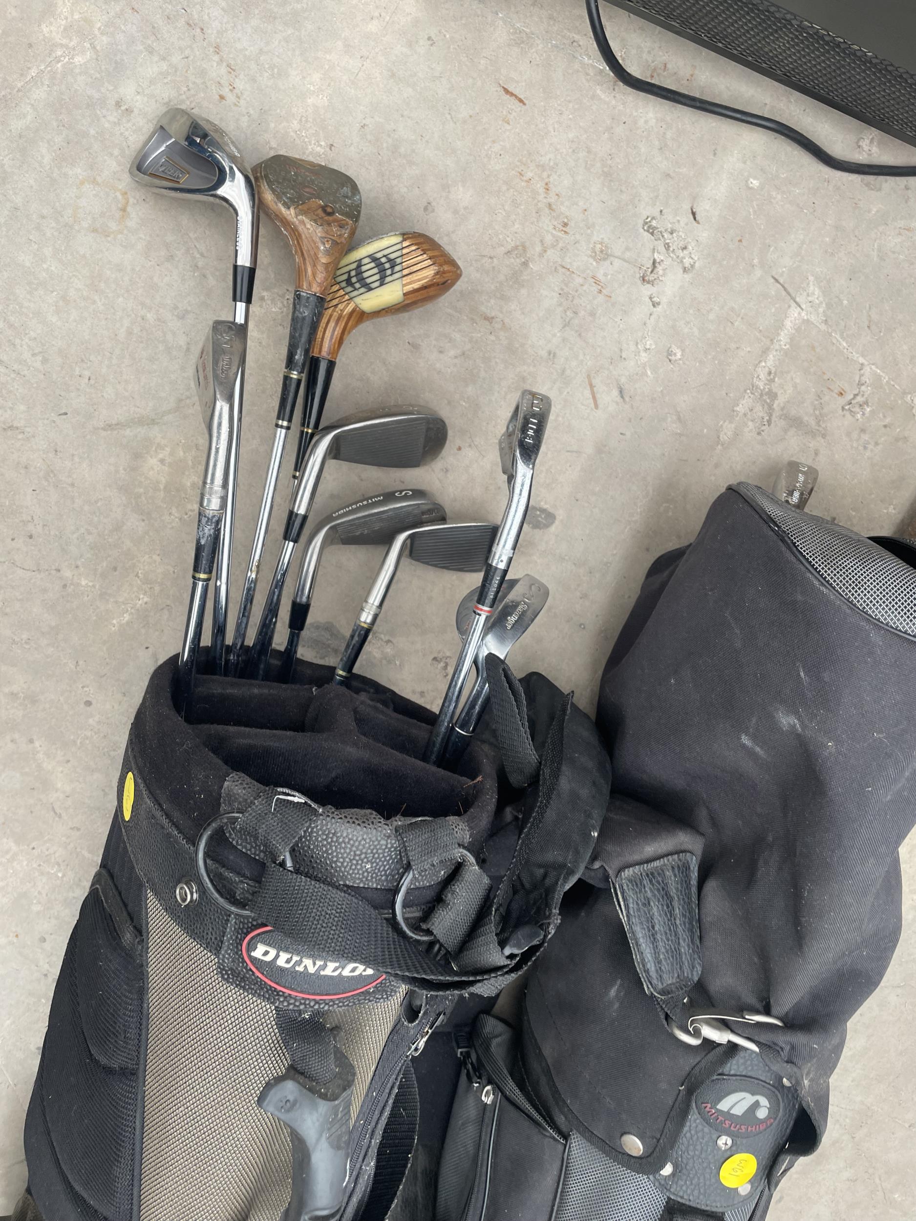 TWO GOLF BAGS WITH AN ASSORTMENT OF GOLF CLUBS AND AN EXERCISE MACHINE - Image 2 of 4