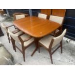 A RETRO TEAK EXTENDING DINING TABLE BY GUDME (DANISH) ON WHALE FIN LEGS, WITH SIX CHAIRS AND 2