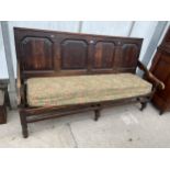 A GEORGE III OAK FOUR PANEL SETTLE, 72" WIDE. N.B. SOME DAMAGE TO ARMS