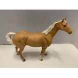 A BESWICK MATT PALAMINO HORSE