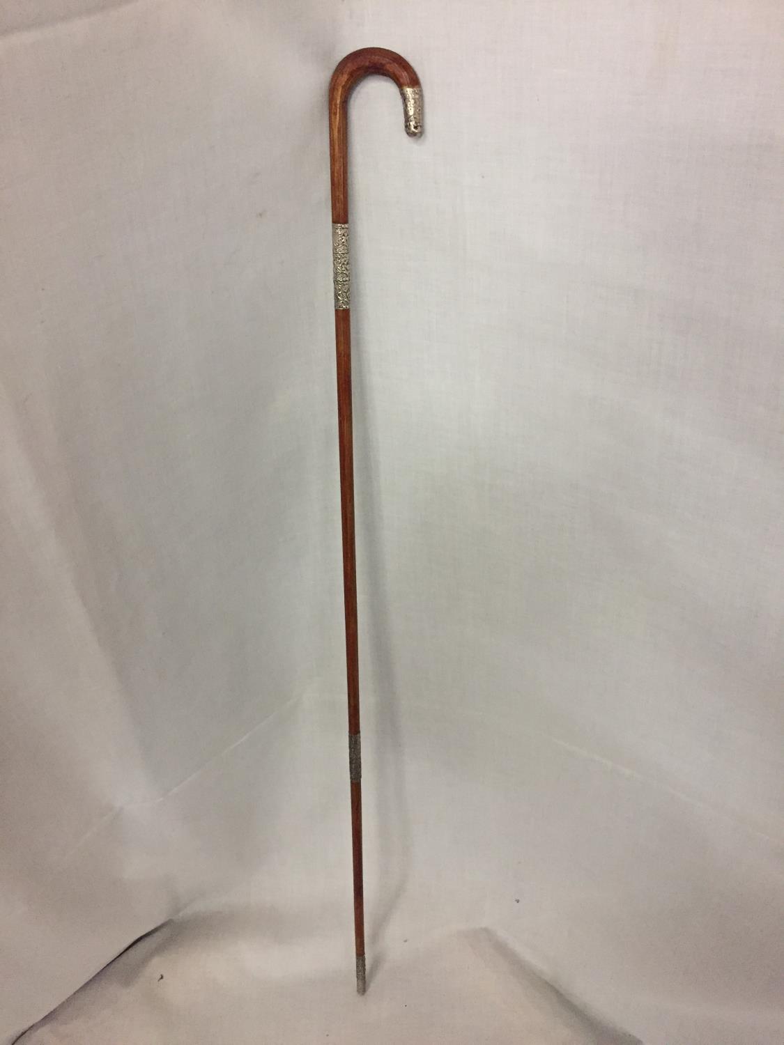 A LADIES SILVER CANE WALKING STICK