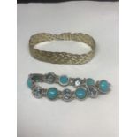 TWO SILVER BRACELETS ONE WITH A WOVEN DESIGN AND ONE WITH TURQUISE AND BLUE STONES