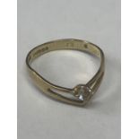 A 9 CARAT GOLD RING SIZE L IN A WISHBONE DESIGN WITH CUBIC ZIRCONIA