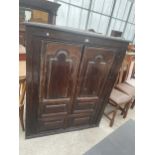 A GEORGIAN OAK TWO DOOR CORNER CUPBOARD WITH SHAPED PANELS, 45.5" WIDE, WITH SHAPED INTERIOR SHELVES