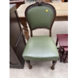 A VICTORIAN OAK FRAMED DINING CHAIR WITH CARVED TOP RAIL, ON TURNED AND FLUTED LEGS