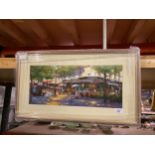 A FRAMED PICTURE OF A FRENCH CAFE SCENE