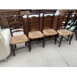 A SET OF FOUR ELM LADDERBACK LANCASHIRE DINING CHAIRS WITH RUSH SEATS
