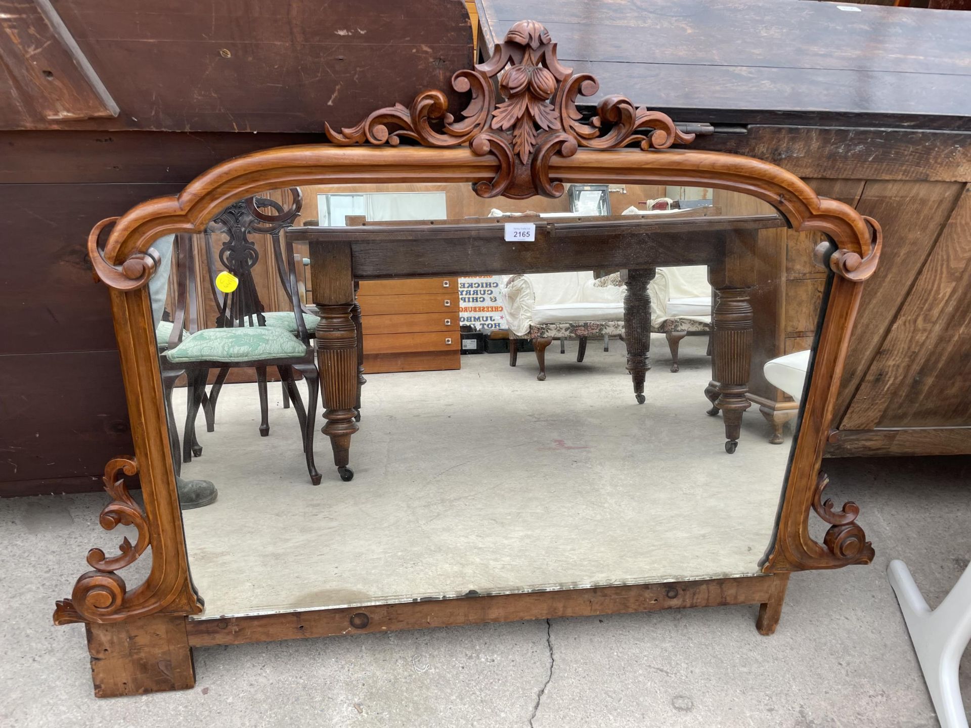 A VICTORIAN WALNUT OVERMANTEL/CHIFFONIER MIRROR, 51" WIDE, WITH FOLIATE CARVING