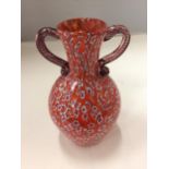 A RED PATTERNED GLASS VASE HEIGHT 19CM.