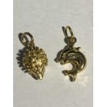 TWO 9 CARAT GOLD CHARMS - A HEDGEHOG AND DOLPHINS GROSS WEIGHT 3.2 GRAMS