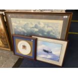 A LARGE FRAMED PICTURE OF A SPITFIRE FLYING THROUGH BROODING SKIES SIZE 91CM X 74CM SIGNED